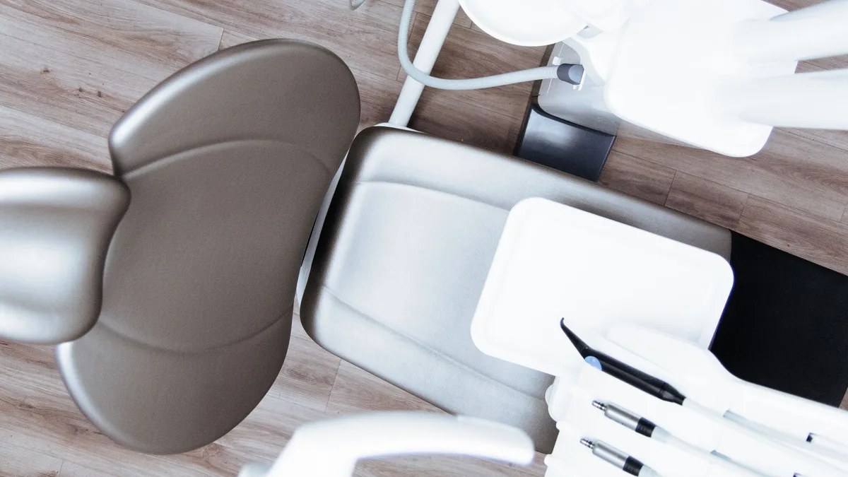 High-angle view of a modern dental chair and equipment setup in a professional clinic.