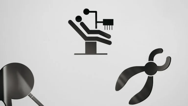 Black dental symbols on a white background, featuring a chair, mirror, and pliers.